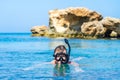 Young man swimming in snorkeling mask at clear azure sea Royalty Free Stock Photo