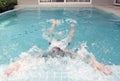 Young man swims up to the termination of a path and concerns a side