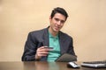 Young man with tablet PC and credit card buying Royalty Free Stock Photo