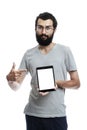 A young man with a tablet shows on an isolated screen. Space for text. White background. Vertical. Mockup