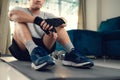 Young man take a break while exercises on yoga mat in living room at home Royalty Free Stock Photo