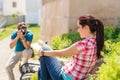 Young man take photo of his girlfriend