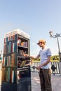 Young man takes books from a free book exchange point. Rostov-on-Don, Russia, august 07 2021 Royalty Free Stock Photo