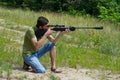 Young man taking aim with the air rifle Royalty Free Stock Photo