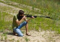 Young man taking aim with the air rifle Royalty Free Stock Photo