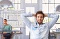 Young man taking break of work at architect office