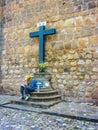 Young Man Taking Notes in the Wall of a Church in Cuzco Royalty Free Stock Photo