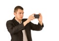 Young man taking a photo with his mobile phone Royalty Free Stock Photo