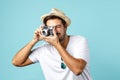 Young man taking a picture with a vintage camera Royalty Free Stock Photo