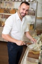 Young man taking with scoop cereals sold Royalty Free Stock Photo