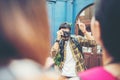 Young man taking selfie of his friends while traveling in urban Royalty Free Stock Photo