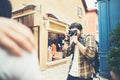 Young man taking selfie of his friends while traveling in urban Royalty Free Stock Photo