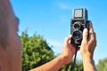 Young man taking a selfie with an old medium forma Royalty Free Stock Photo