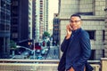 Young man talking on cell phone outdoors in New York City Royalty Free Stock Photo