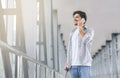 Young man talking on phone in airport terminal Royalty Free Stock Photo