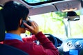 Young man talking on the phone and driving car Royalty Free Stock Photo