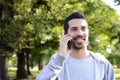 Young man talking on the phone. Outdoors. Royalty Free Stock Photo