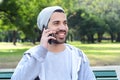 Young man talking on the phone. Outdoors. Royalty Free Stock Photo