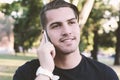 Young man talking on the phone. Outdoors. Royalty Free Stock Photo