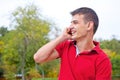 Young man talking on phone smiling