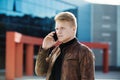 Young man talking on the phone, using smartphone, making a call. Royalty Free Stock Photo