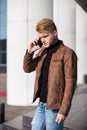 Young man talking on the phone, using smartphone, making a call. Royalty Free Stock Photo