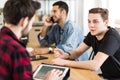 Young man talking to a stockbroker about investing in digital mo Royalty Free Stock Photo