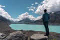 Young man on Tasman Lake viewpoint. Aoraki, Mount Cook National Park. New Zealand Royalty Free Stock Photo