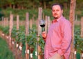 Young man is tasting red wine Royalty Free Stock Photo