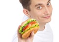 Young man with tasty fast food unhealthy burger