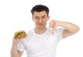 Young man with tasty fast food unhealthy burger