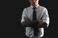 Young man with tattoos on black background, closeup. Space for text Royalty Free Stock Photo