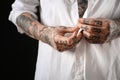 Young man with tattoos on body against black background, closeup Royalty Free Stock Photo