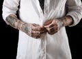 Young man with tattoos on body against black background, closeup Royalty Free Stock Photo