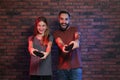 Young man and teenage girl playing video games Royalty Free Stock Photo