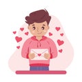 Young man or teenager in love, holding an envelope with a love heart, feeling passion and love, Valentine's day Royalty Free Stock Photo