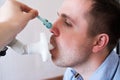 Young man testing breathing function by spirometry Royalty Free Stock Photo