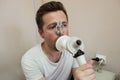 Young man testing breathing function by spirometry Royalty Free Stock Photo