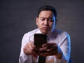 Young Man Texting Reading Chatting on His Phone Royalty Free Stock Photo