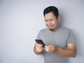 Young Man Texting Reading Chatting on His Phone Sad Crying Royalty Free Stock Photo