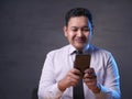 Young Man Texting Reading Chatting on His Phone, Smiling Happy Royalty Free Stock Photo