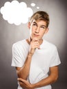 Young man thinking with a cloud over his head