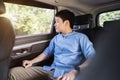 Man thinking and looking view out of window while sitting in the back seat of car Royalty Free Stock Photo