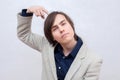Young man thinks hard. Index finger near the head. Royalty Free Stock Photo
