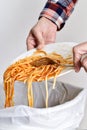 Young man throwing leftovers to the trash bin Royalty Free Stock Photo