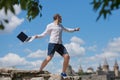 Young man throws a laptop