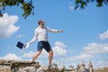 Young man throws a laptop