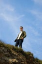 A young man on the top of the cliff