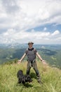 Young man on top of the mountain