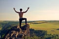 Young man on top of rock Royalty Free Stock Photo